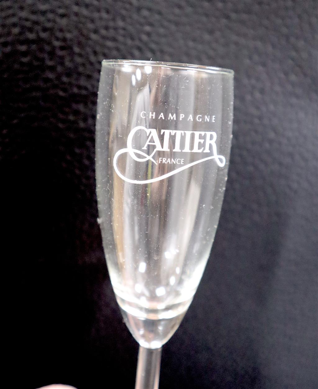 A carton of four individual presentation boxes containing a half bottle of Cattier Champagne with two champagne glasses